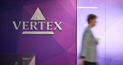 Three employees working together in the Vertex Sydney office.