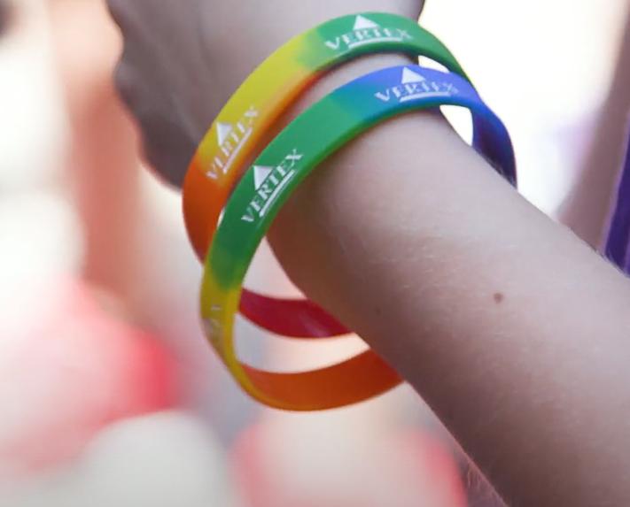 Vertex employees with wristbands at pride parade