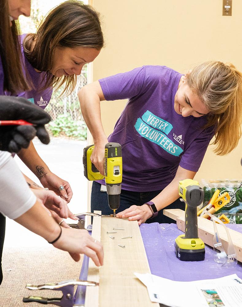 Volunteers from Vertex working on a community project