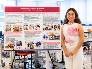 An image of Jessica Meija smiling while standing next to a poster detailing her experience as part of the Summer 2024 Learning Lab program.