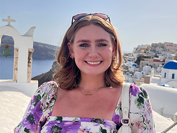 An image of Gabrielle Capesius in Greece smiling at the camera