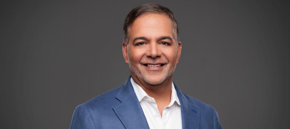 A headshot of Amit Sachdev, Executive Vice President, Chief Patient and External Affairs Officer at Vertex Pharmaceuticals